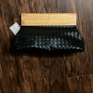 Black woven clutch